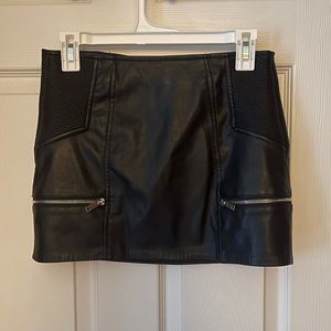 vintage leather skirt with accent zippers on front and back for a flirty touch